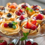 puff pastry dessert recipes ;A beautifully arranged platter of assorted mini fruit tarts and pastries.